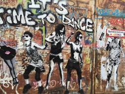 dancing girls on graffiti in berlin