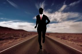 silhouette of businessman running on highway