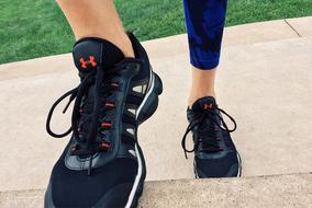legs in sports shoes on fitness workout close up