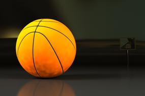 closeup picture of weathered Ball of basketball at darkness