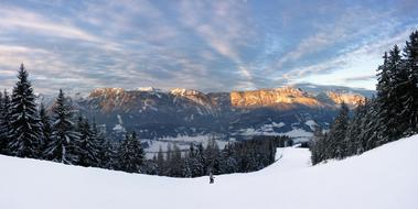 sunbeams over the snowy dachstein mountain