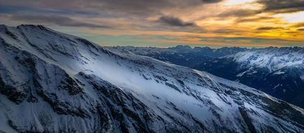 snow Alps at sunset background