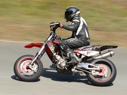motorcyclist rides at high speed on the road