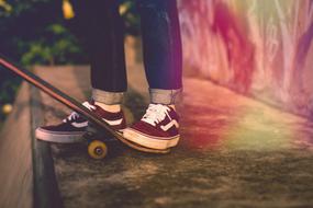 teenager legs and skateboard