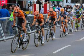 germany tour bicycle racers on road in city