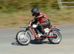 high-speed motorcycle on the road in a blurred background