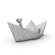 painted white man on a paper boat