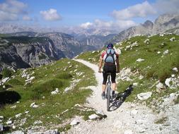 girl on a mountain bike on skolne mountains in South Tyrol