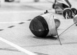 masks and swords for fencing on the floor