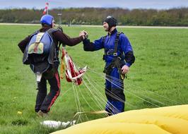 handshake of people near the parachute