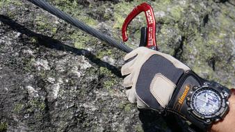 photo of a climberâs hands and fastening to a rope