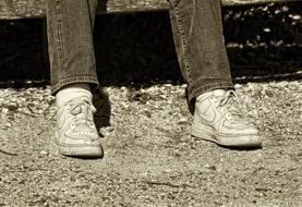 photo of man's legs in sports shoes