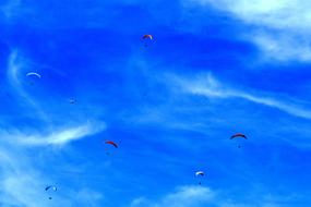 group of Paragliders at sky