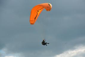 orange paraglider Sailing