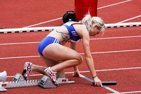 Athletics, caucasian female Runner on start