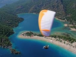 Paragliding over picturesque landscapes on a sunny day