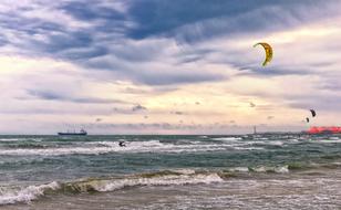 windsurfing on the Mediterranean coast on a cloudy day