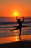 Dancer silhouette on Ocean beach