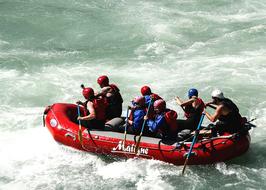 team of rowers on a inflatable raft