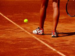 Tennis Racket and green ball