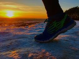 sports shoes on the feet of the athlete