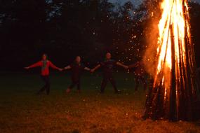 round dance of people around the fire