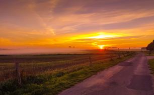 distant view of the morning sun on the horizon in the countryside