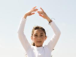 girl in a dance pose close-up