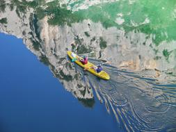 two persons in Kayak on water at cliff, france, Gorges You Verdon