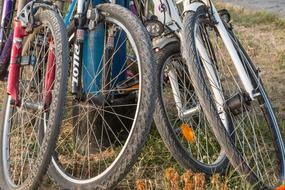 photo of four bicycle wheels on the field