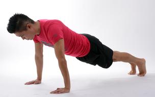 japanese man doing push-ups