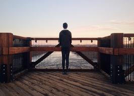 man on the bridge at dusk