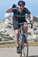 Cyclist Professional on the road in the mountains