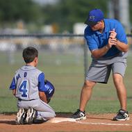 children playing baseball on a blurred background