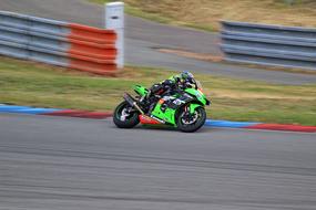 green Bike Kawasaki on the race track