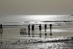 football on wet sand on the beach