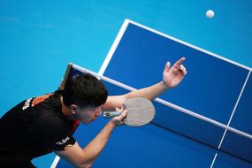 ping pong Player at blue table