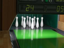 white skittles on a green track in bowling