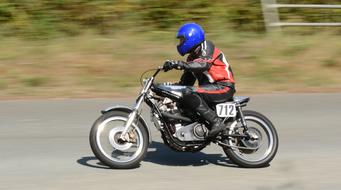 sportsman Speeding Motorbike on road