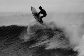 black and white, surfer on the wave