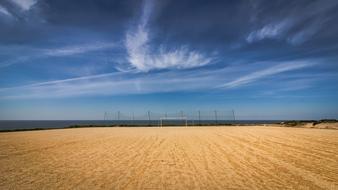 Soccer Goal on sand beach at sea