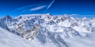 panorama of snowy alps, view from the ski lift