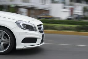 white car in motion in a blurred background