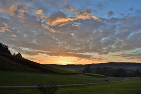 sunrise in the clouds over the countryside