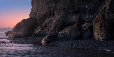 dark rocks on Pacific Coastline at dusk, usa, washington, olympic national park