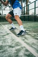 tennis player's feet on the court