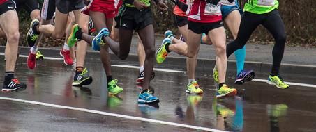 Running people in rain