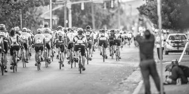 black and white photo of bicycle racing