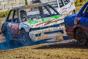 Colorful cars in motion, on the dirt, on the competition