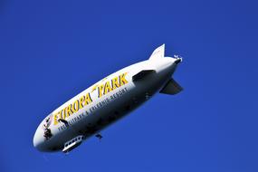 Colorful Zeppelin airship above Bodensee in the blue sky
